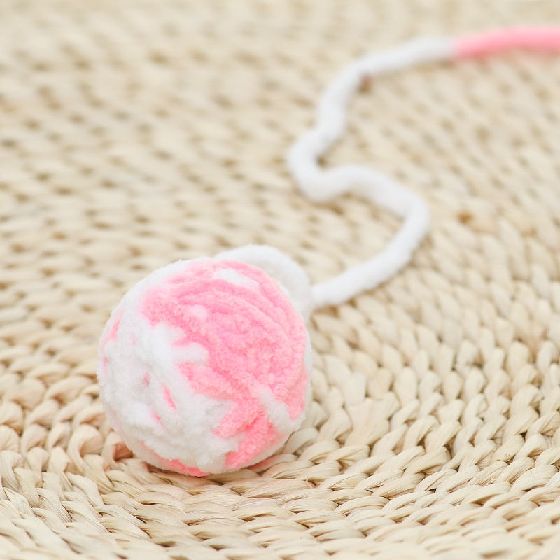 Đồ chơi cuộn len cho mèo màu hồng trắng Đồ chơi cuộn len cho mèo màu hồng trắng